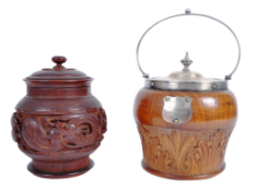 TWO 19TH CENTURY & LATER CARVED WOOD TOBACCO JARS