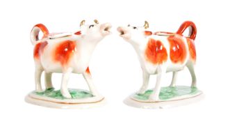 PAIR OF 19TH CENTURY STAFFORDSHIRE COW CREAMER JUG