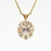 COLLECTION OF GOLD PLATED WHITE STONE PENDANTS