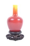 CHINESE APPLE GLAZE POTTERY VASE ON STAND