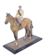 20TH CENTURY PAINTED METAL MOUNTED JOCKEY MATCH STRIKER