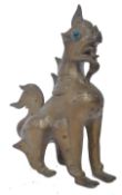 BURMESE BRASS FIGURED FOO DOG WITH JEWEL ENCRUSTED EYES