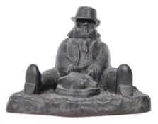 EARLY 20TH CENTURY CAST IRON INKWELL AS DANIEL LAMBERT