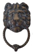 ANTIQUE BRASS DOOR KNOCKER IN THE FORM OF A LION'S HEAD