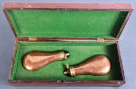 CASED PAIR OF 19TH CENTURY PISTOL POWDER FLASKS