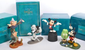 CLASSICS WALT DISNEY COLLECTIONS - FOUR PORCELAIN FIGURES