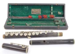 AN EARLY 20TH CENTURY RUDALL CARTE WOOD FLUTE INSTRUMENT