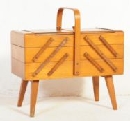 A VINTAGE RETRO MID CENTURY TEAK METAMORPHIC SEWING BOX