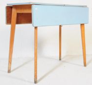 A 1950'S TEAK FRAME FORMICA TOP DROP LEAF DINING TABLE