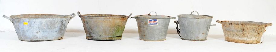 FOUR 20TH CENTURY GALVANIZED METAL INDUSTRIAL PLANTERS