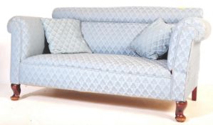 A LATE VICTORIAN OAK CHESTERFIELD DROP ARM SOFA SETTEE