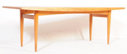 A MID CENTURY DANISH STYLE TEAK WOOD LONG JOHN COFFEE TABLE