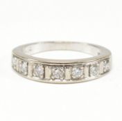 18CT WHITE GOLD & DIAMOND SEVEN STONE RING