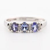 HALLMARKED 9CT WHITE GOLD TANZANITE & DIAMOND RING
