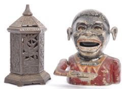 A PAIR OF VICTORIAN & 1940S NOVELTY CAST IRON MONEY BOXES