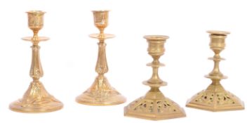 TWO PAIRS OF EARLY 20TH CENTURY BRASS CANDLESTICK HOLDERS