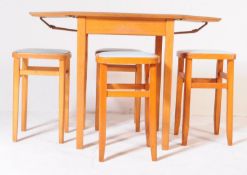 A RETRO MID 20TH CENTURY FORMICA KITCHEN TABLE WITH STOOLS