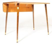 A MID CENTURY CIRCA 1950'S RED FORMICA DINING TABLE