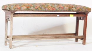 AN EARLY 20TH CENTURY OAK DUET PIANO STOOL