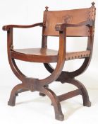 AN EARLY 20TH CENTURY SAVONAROLA ARMCHAIR