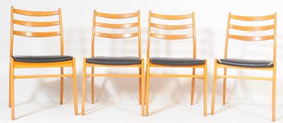 FOUR RETRO BEECH WOOD AND VINYL KITCHEN CHAIRS