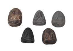 FIVE EARLY 20TH CENTURY THAI HAND CARVED AMULETS