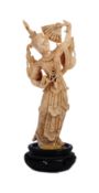 EARLY 20TH CENTURY BONE THAI DANCER IN TRADITIONAL ROBE