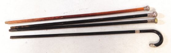 FOUR 20TH CENTURY SILVER HALLMARKED WALKING STICKS