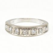 18CT WHITE GOLD & DIAMOND SEVEN STONE RING