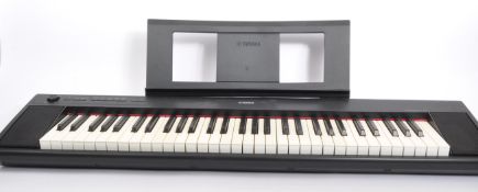 A CONTEMPORARY YAMAHA NP12 SLIMLINE HOME KEYBOARD