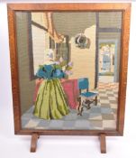 A MID CENTURY OAK FRAMED & EMBROIDERED FIRE GUARD