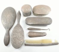 20TH CENTURY WHITE METAL COVERED ANGLO COLONIAL VANITY DRESSING SET