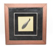 FRAMED WHITE METAL AND ENAMEL TRIBAL TOOL
