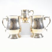 COLLECTION OF THREE HALLMARKED MID CENTURY SILVER TANKARDS