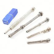 COLLECTION OF FIVE WHITE METAL PROPELLING PENCILS