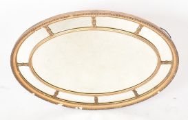 19TH CENTURY VICTORIAN OVAL GILTWOOD AND GESSO MIRROR