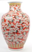 LARGE CHINESE VASE IN RED EMBELLISHED WITH CRANES & BLOSSOM