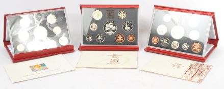 THE ROYAL MINT - THREE UNITED KINGDOM DELUXE PROOF COIN SETS