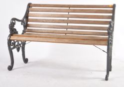 20TH CENTURY GARDEN CAST IRON AND TEAK BENCH
