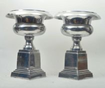PAIR OF 20TH CENTURY CHROME CAMPANA SHAPED URNS