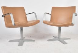 INNO - MATCHING PAIR OF LEATHER SWIVEL ARMCHAIRS