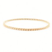 YELLOW METAL TWISTED BANGLE BRACELET