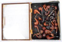 COLLECTION OF TOBACCO PIPES IN A GLAZED DISPLAY CASE