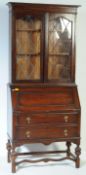 1920S JACOBEAN REVIVAL CARVED OAK BUREAU BOOKCASE