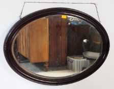LARGE EDWARDIAN MAHOGANY OVAL WALL MOUNTED MIRROR