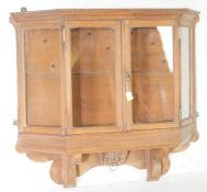 20TH CENTURY TRAPEZOID WALL MOUNTED GLAZED DISPLAY CABINET