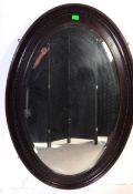 LARGE OVAL EDWARDIAN MAHOGANY WALL MIRROR