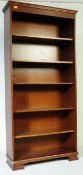 20TH CENTURY CARVED OAK VENEERED OPEN BOOKCASE