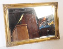 LARGE GILT FRAMED BEVELLED EDGED OVERMANTEL MIRROR