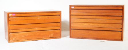 TWO VINTAGE TEAK WOOD GRADUATING CHEST OF DRAWERS